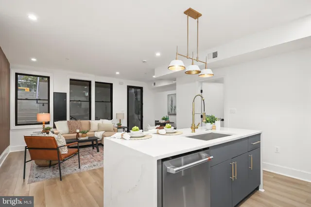 a view of living room with granite countertop furniture and a chandelier