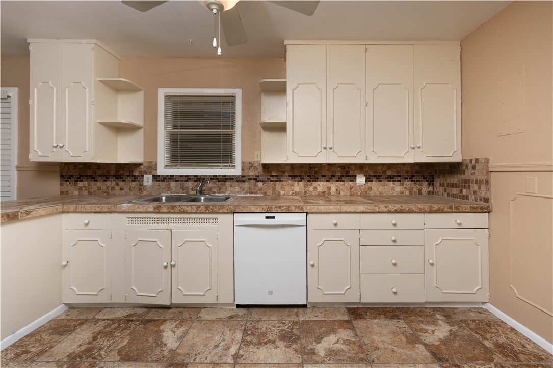622 Deforrest Street Corpus Christi, TX 78404 - Photo 4 of 14 a view of granite countertop white cabinets
