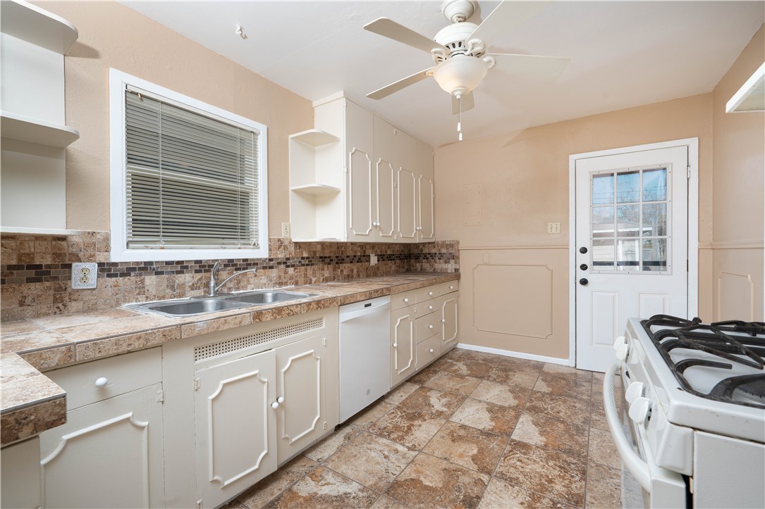 622 Deforrest Street Corpus Christi, TX 78404 - Photo 5 of 14 a kitchen with a sink stove and cabinets