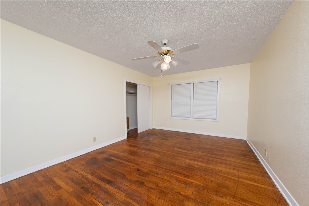 622 Deforrest Street Corpus Christi, TX 78404 - Photo 8 of 14 an empty room with a window and a ceiling fan