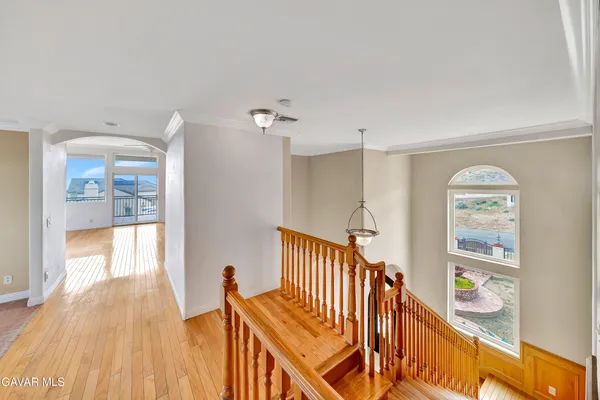 a kitchen with stainless steel appliances granite countertop a refrigerator a sink and a stove