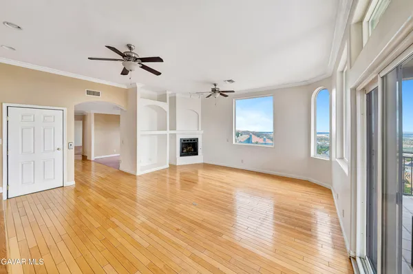 a dining room with furniture window and wooden floor