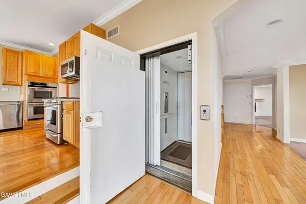 a view of a hallway with a white walls
