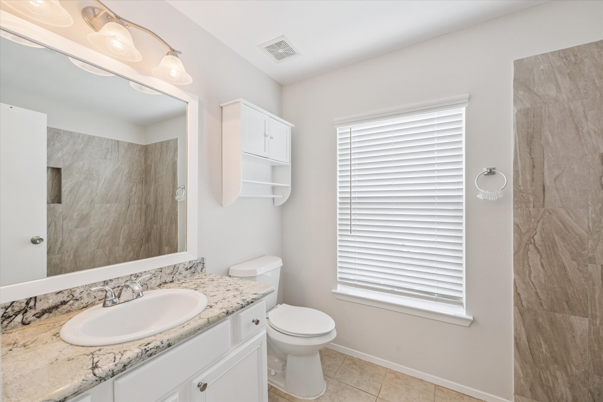 6205 Lone Prairie Way Katy, TX 77449 - Photo 13 of 21 a bathroom with a granite countertop sink toilet and mirror