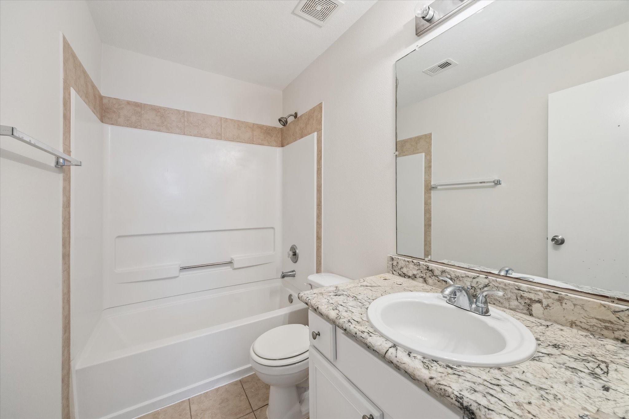 6205 Lone Prairie Way Katy, TX 77449 - Photo 16 of 21 a bathroom with a granite countertop sink toilet and shower