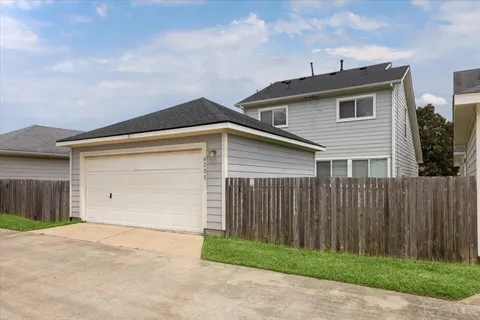 a front view of a house with a garage
