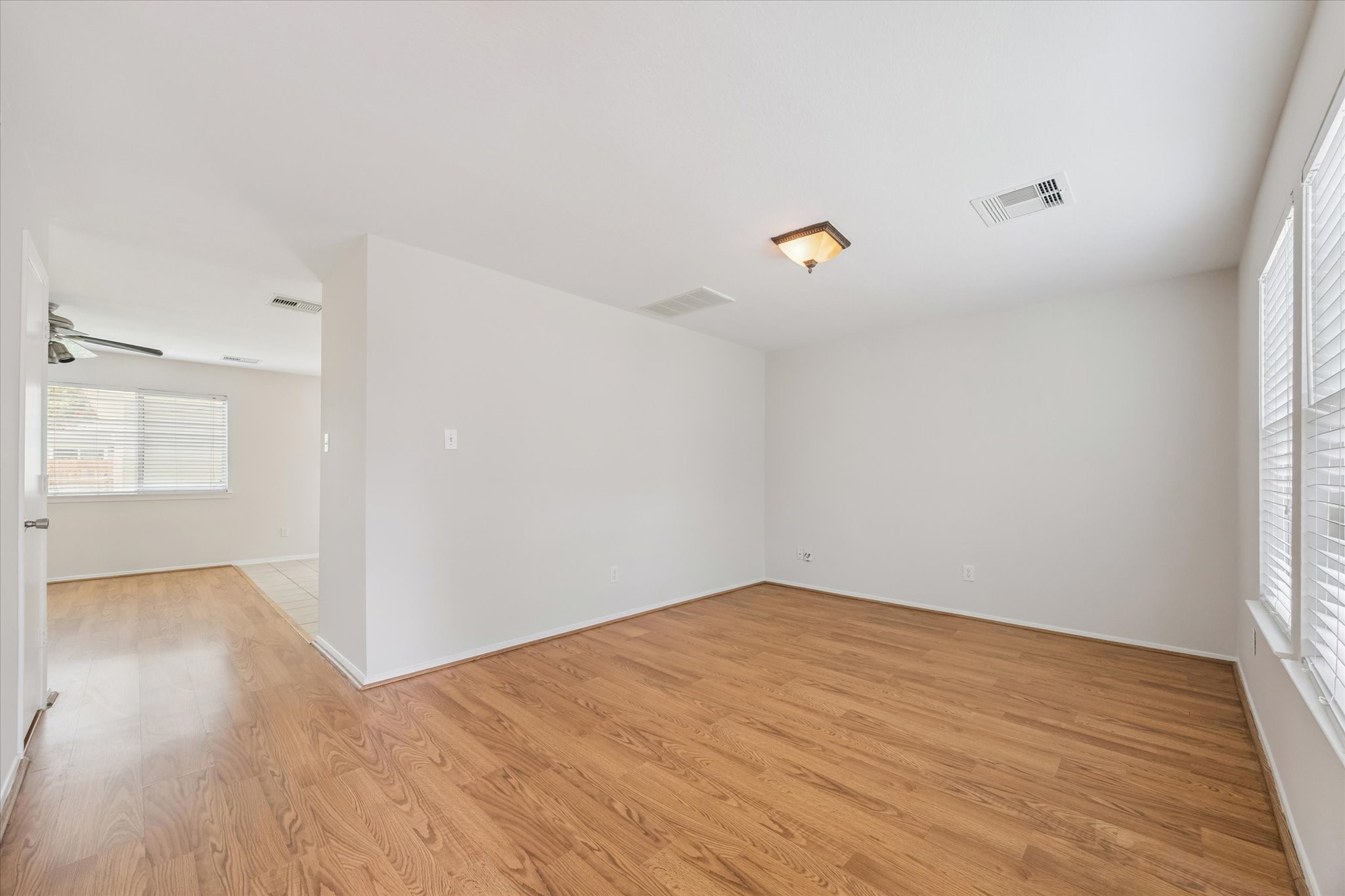 6205 Lone Prairie Way Katy, TX 77449 - Photo 6 of 21 a view of empty room with wooden floor and fan