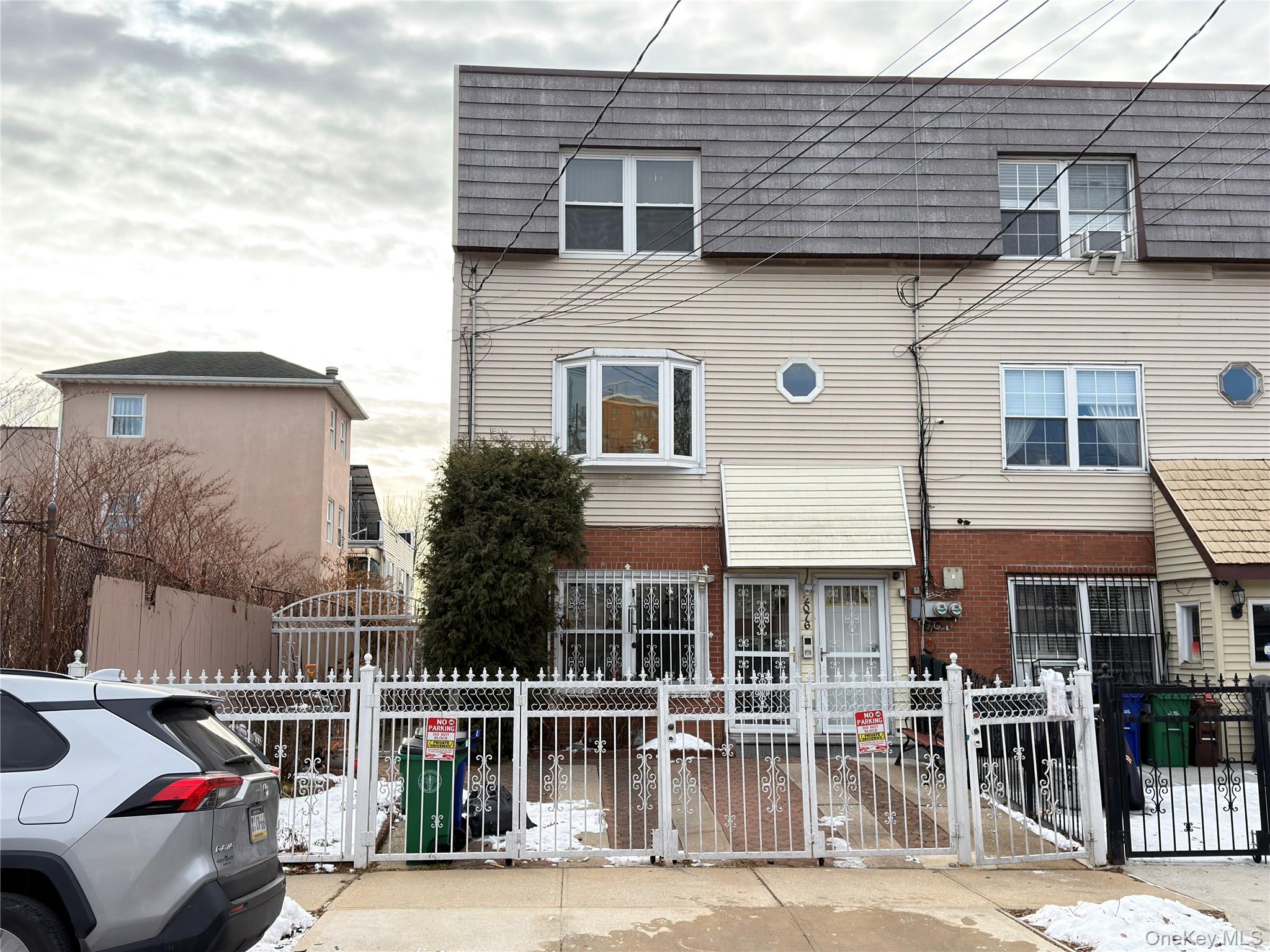 2076 Caesar Place Bronx, NY 10473 - Photo 2 of 8 a front view of a house with a yard