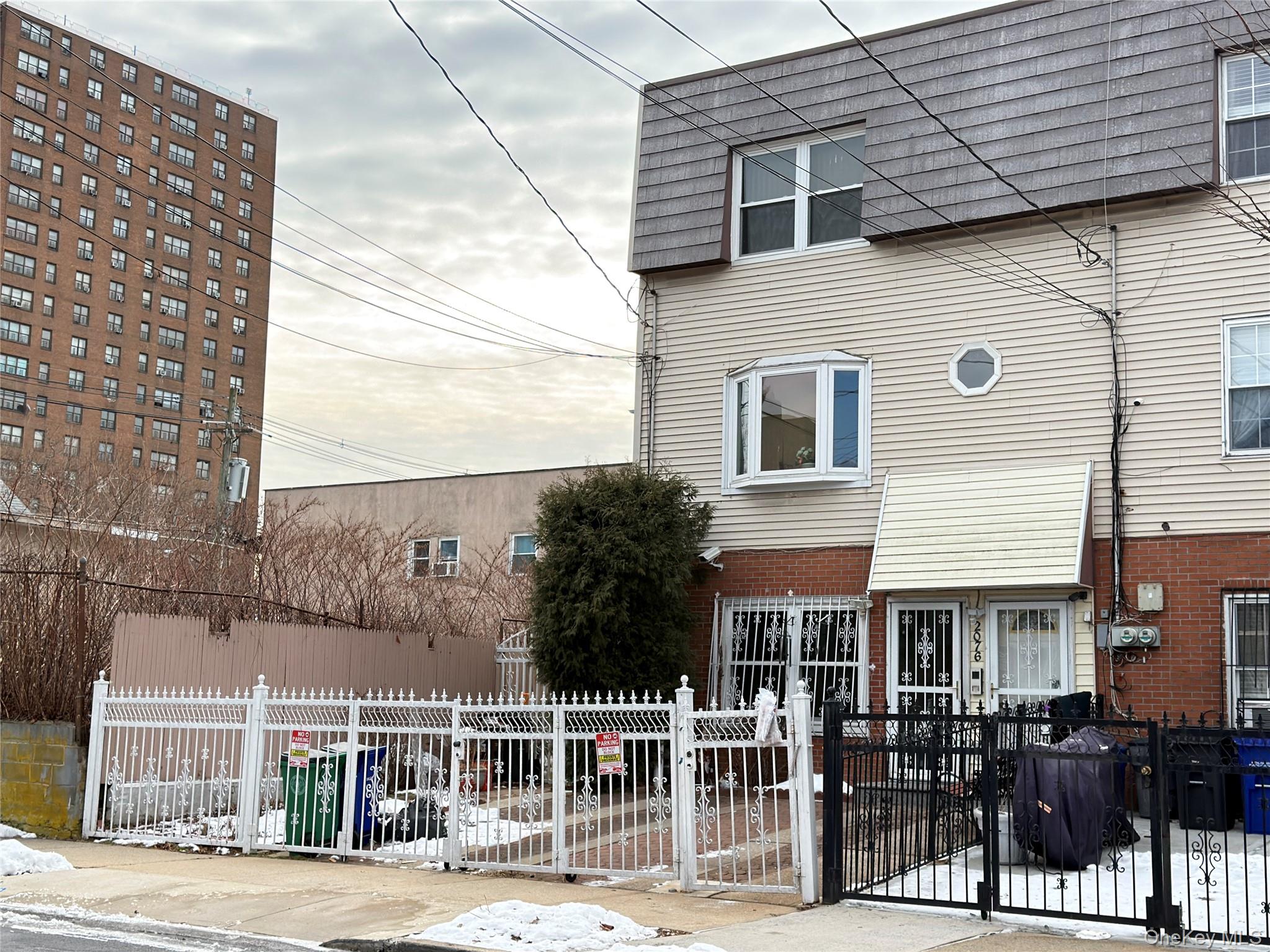 2076 Caesar Place Bronx, NY 10473 - Photo 6 of 8 a front view of a building with glass windows