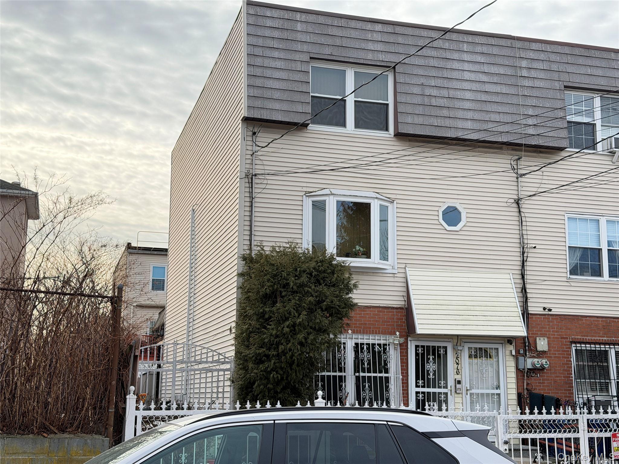 2076 Caesar Place Bronx, NY 10473 - Photo 8 of 8 a front view of a residential houses with yard