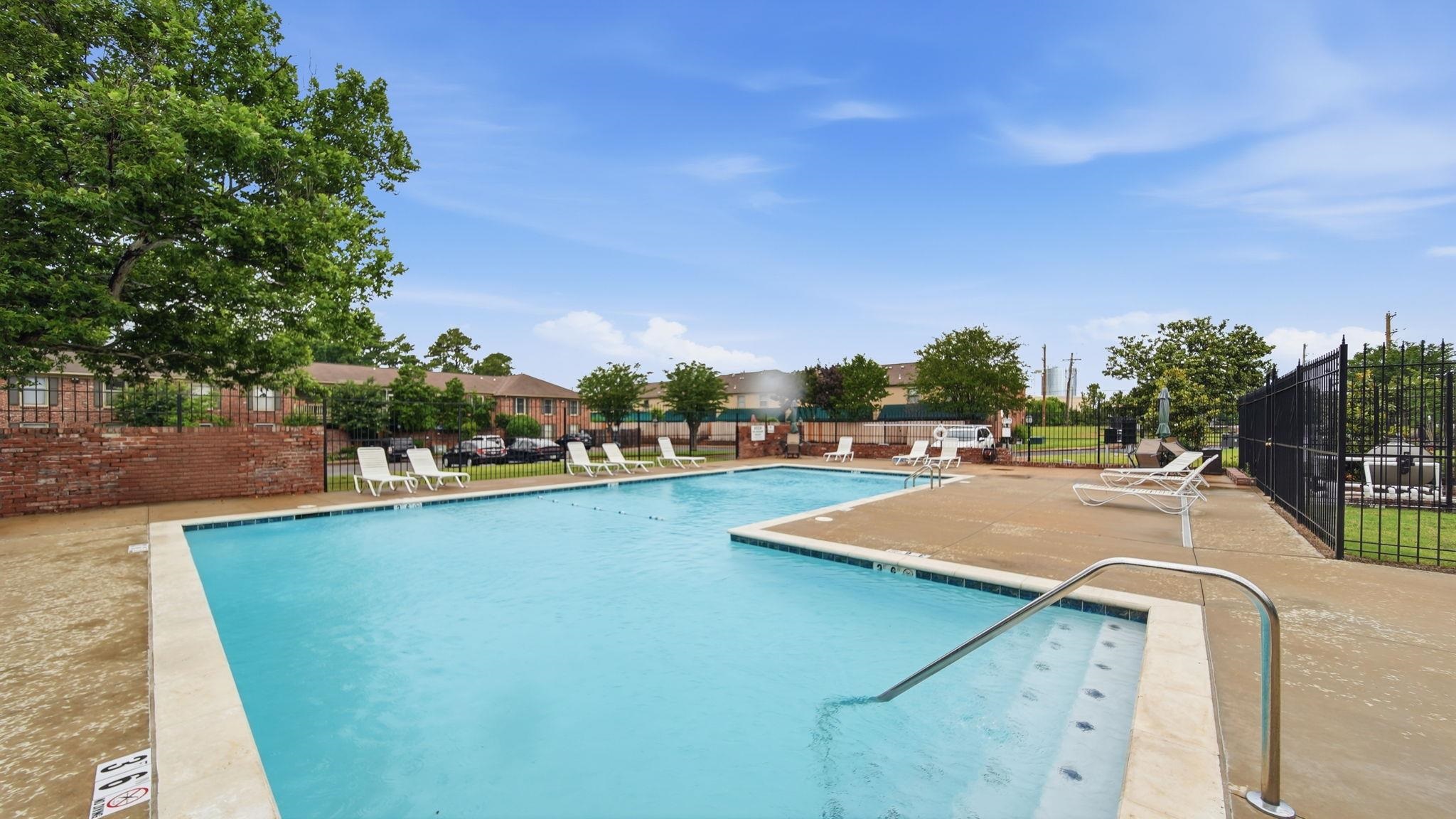 5866 Roxbury Drive, Unit 5866 Memphis, TN 38119 - Photo 17 of 20 Community swimming pool featuring a concrete deck and integrated entry steps with a stainless steel handrail