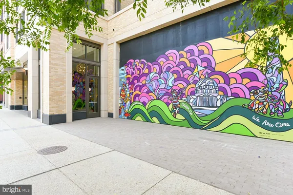an outdoor sitting area with a lake view and city view
