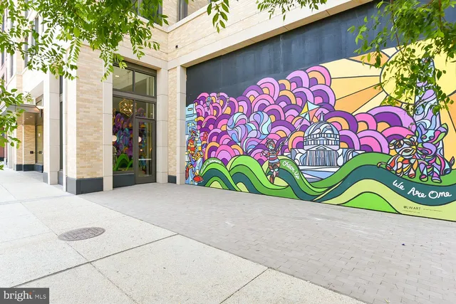 an outdoor sitting area with a lake view and city view