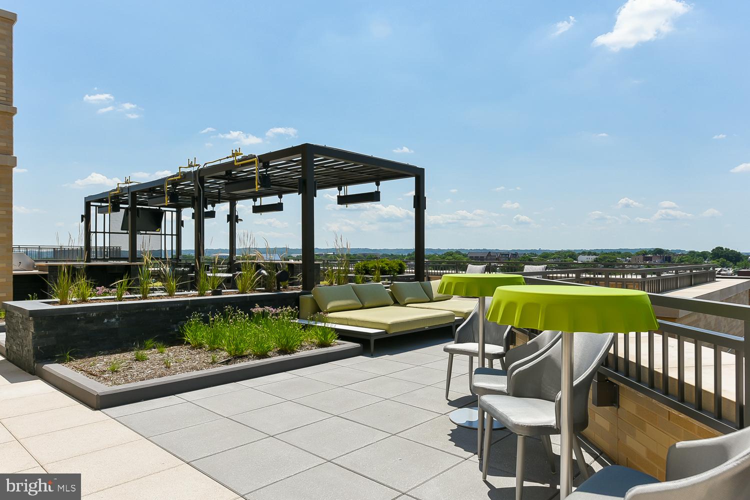 901 H Street Northeast, Unit AT D Washington, DC 20002 - Photo 41 of 82 a view of swimming pool with outdoor seating and plants