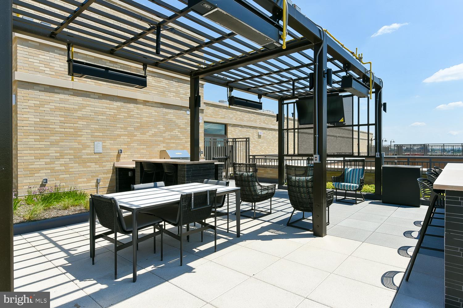 901 H Street Northeast, Unit AT D Washington, DC 20002 - Photo 46 of 82 a view of a patio with dining table and chairs