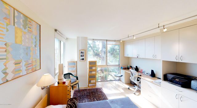 a view of a kitchen with workspace and a window