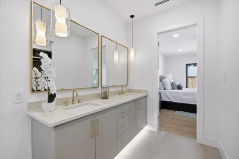 a large bedroom with a large bed and a large window