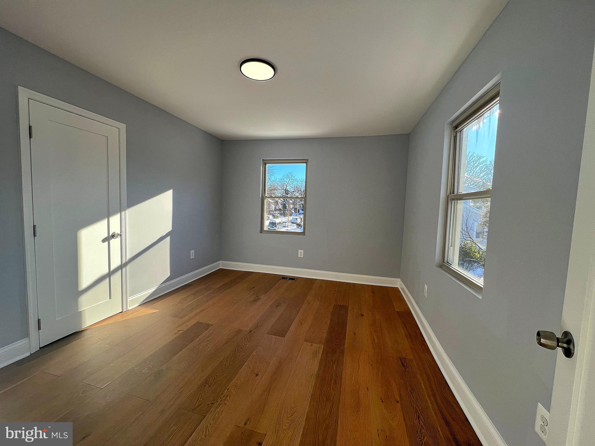 4311 Miami Place Baltimore, MD 21207 - Photo 17 of 26 wooden floor in an empty room with a window