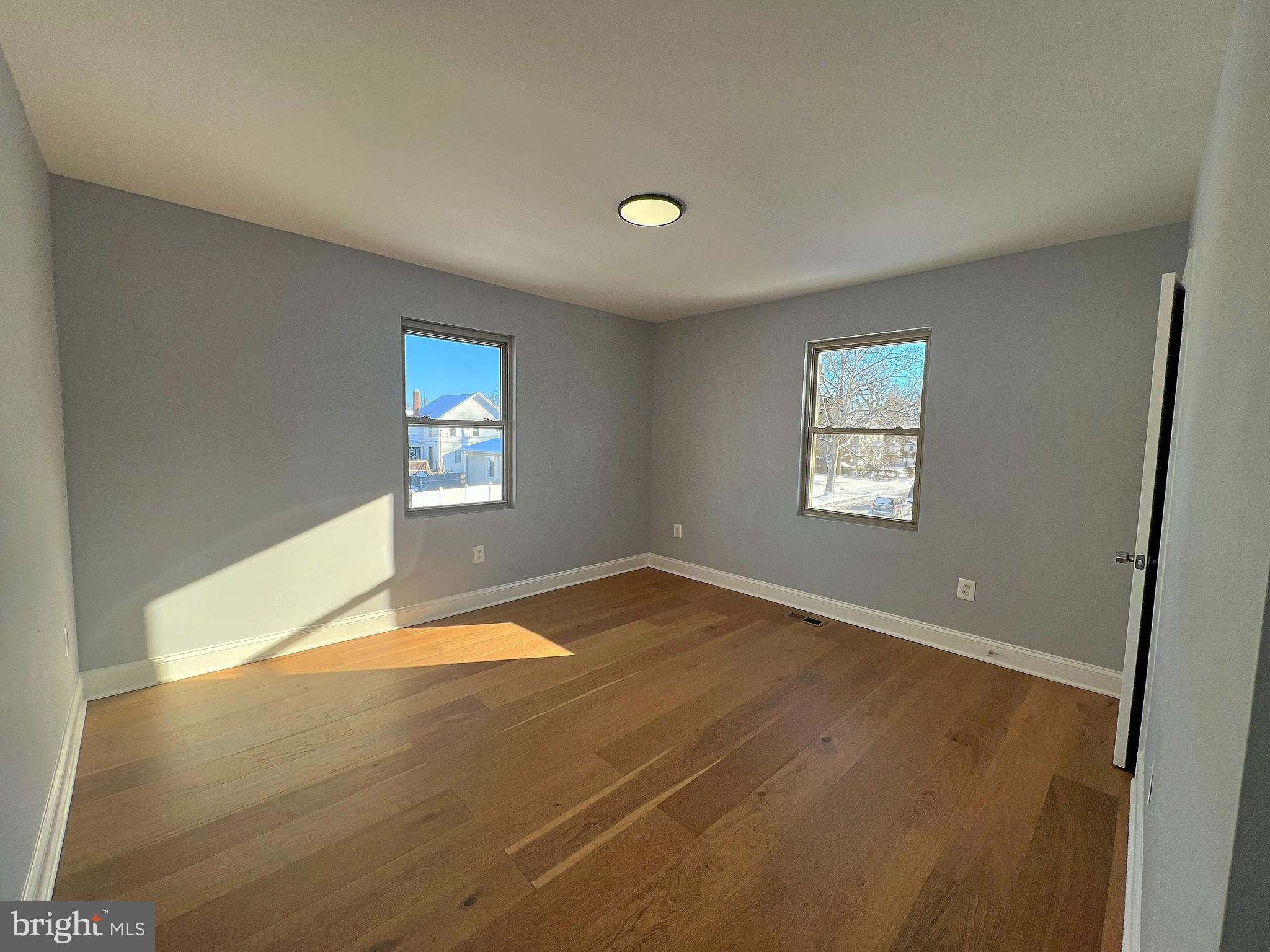 4311 Miami Place Baltimore, MD 21207 - Photo 18 of 26 a view of empty room with wooden floor and fan