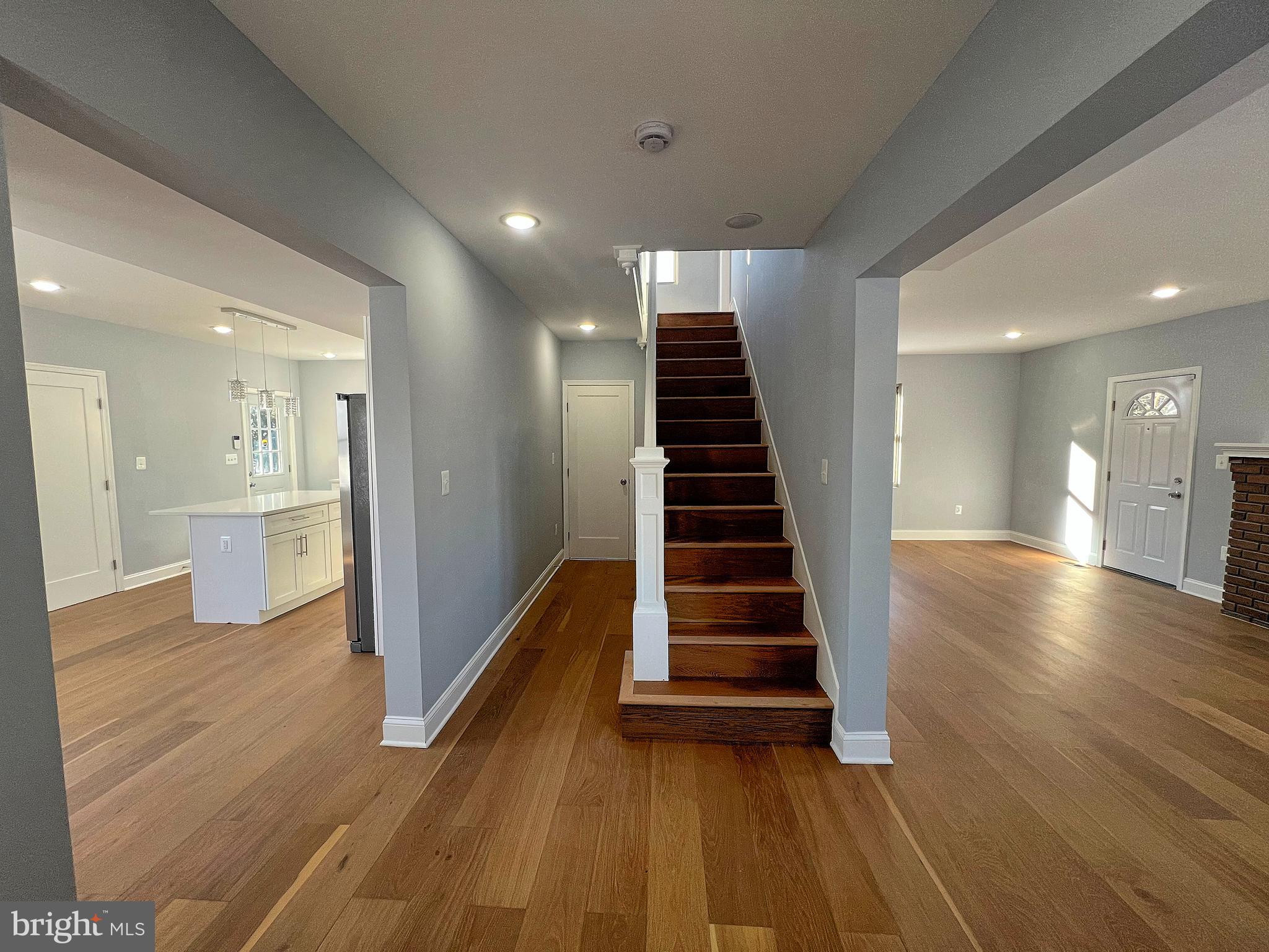 4311 Miami Place Baltimore, MD 21207 - Photo 2 of 26 a view of a hallway with wooden floor and staircase