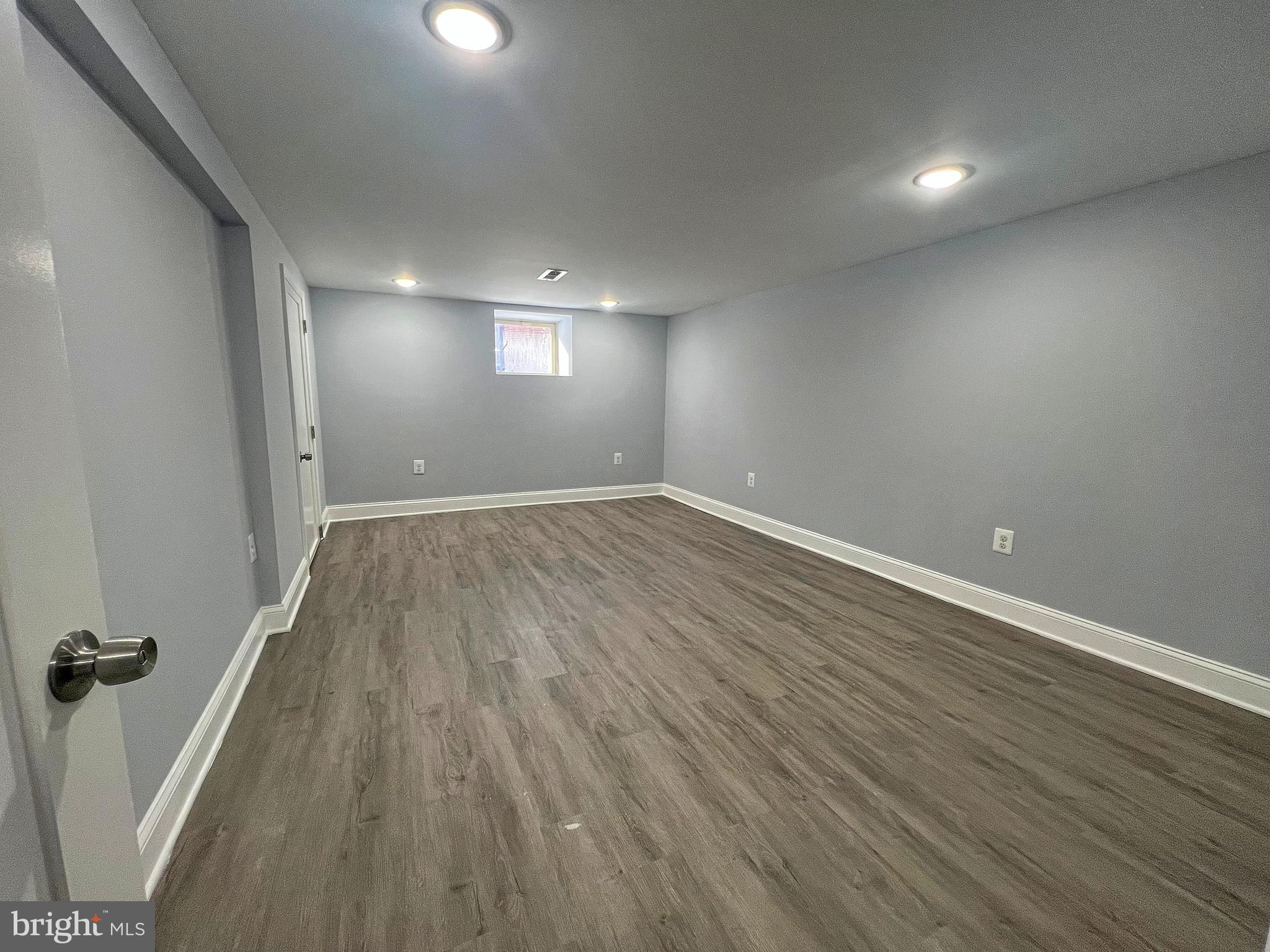 4311 Miami Place Baltimore, MD 21207 - Photo 23 of 26 wooden floor in an empty room with a window