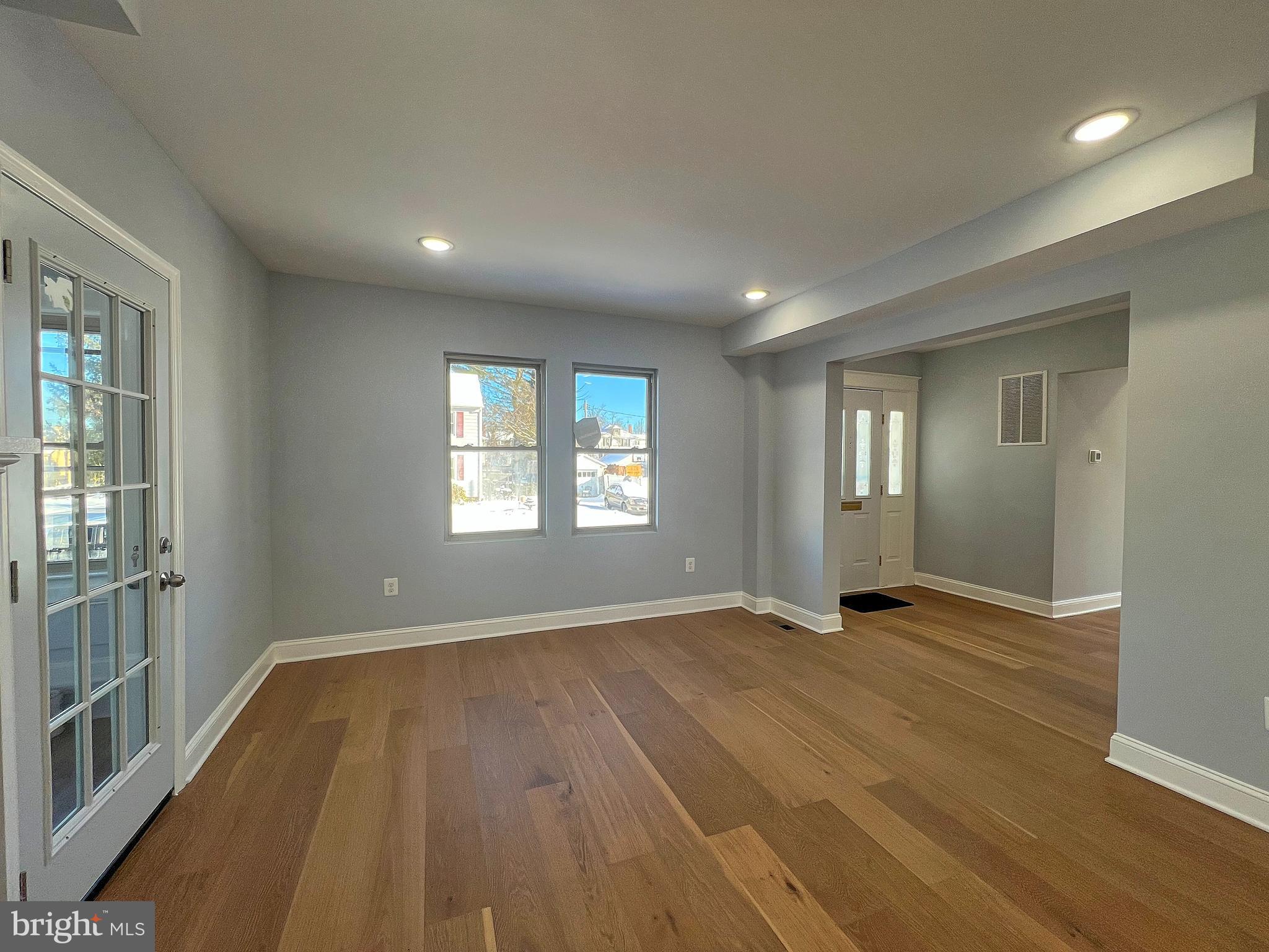 4311 Miami Place Baltimore, MD 21207 - Photo 6 of 26 wooden floor in an empty room with a window