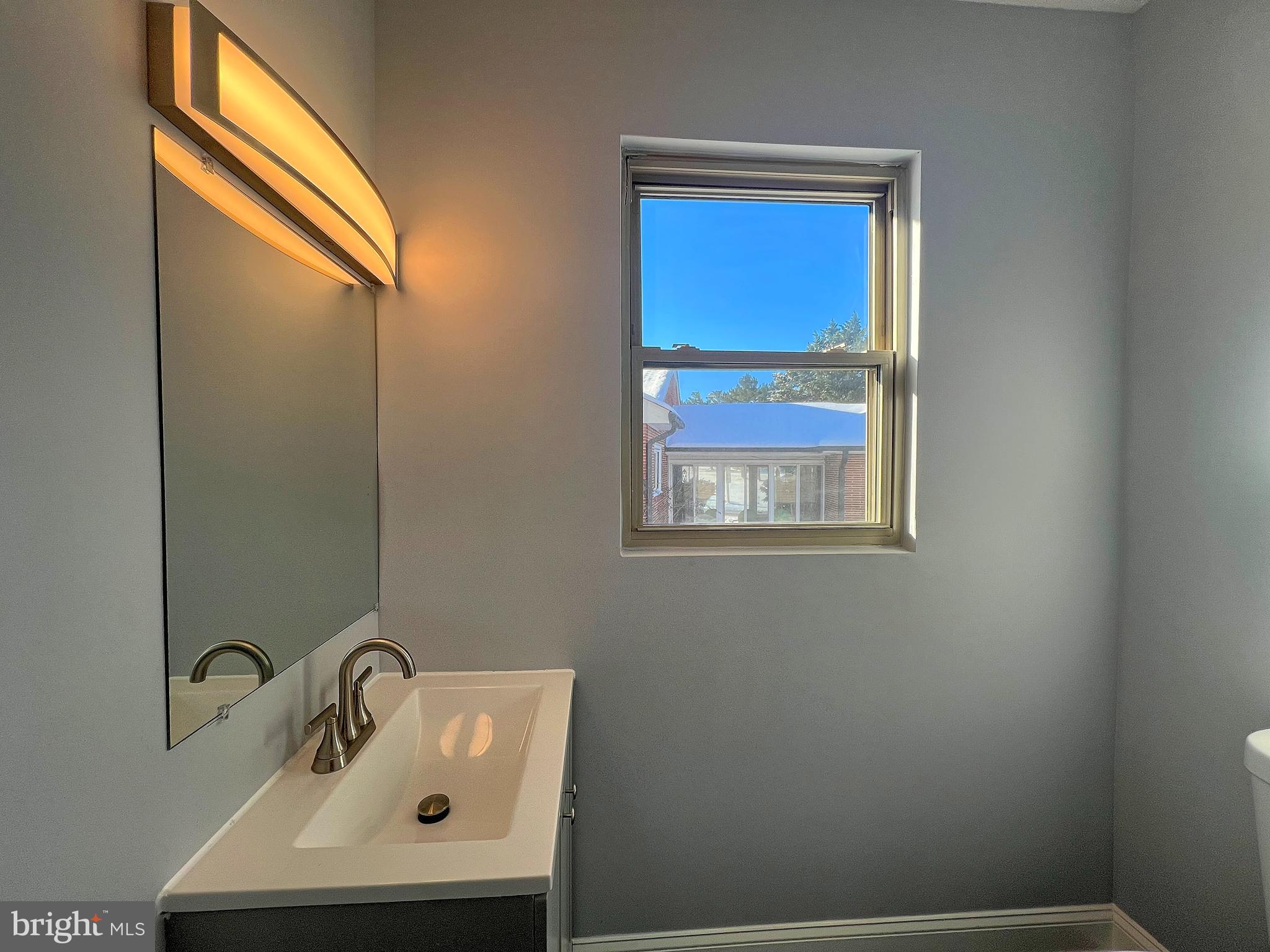 4311 Miami Place Baltimore, MD 21207 - Photo 7 of 26 a bathroom with a sink and a mirror