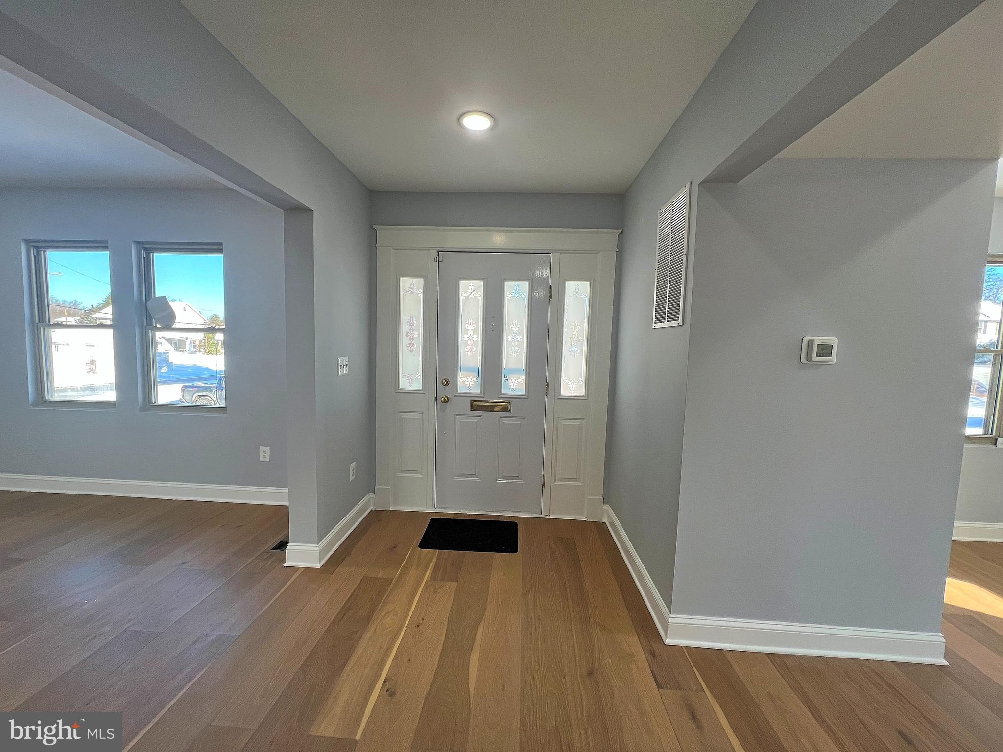 4311 Miami Place Baltimore, MD 21207 - Photo 8 of 26 wooden floor in an empty room with a window