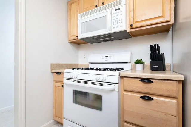 a view of washer and dryer with kitchen