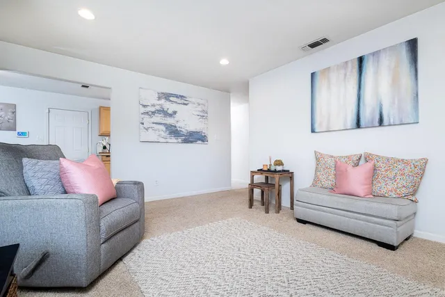 a living room with furniture and a couch