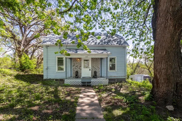 front view of a house with a garden