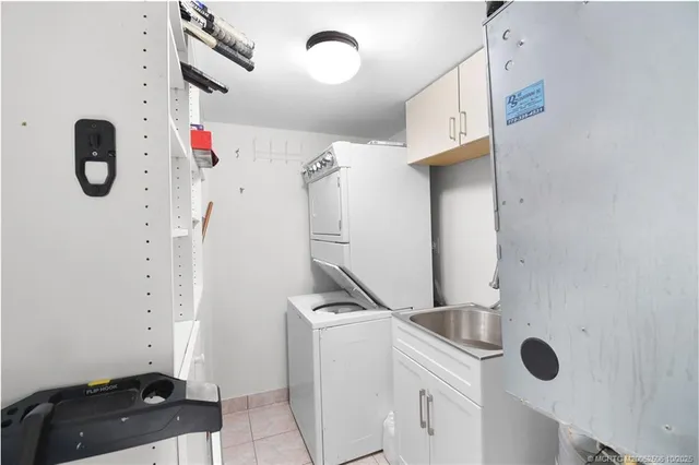 a spacious bedroom with a large bed and a large window