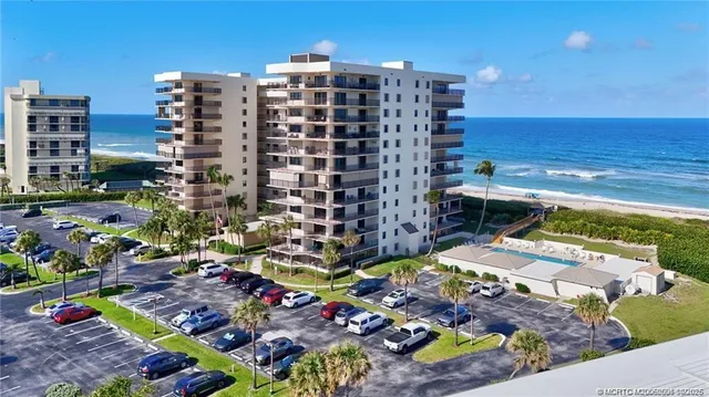 a view of an ocean with a floor to ceiling window
