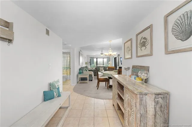 a kitchen with stainless steel appliances white cabinets and a refrigerator