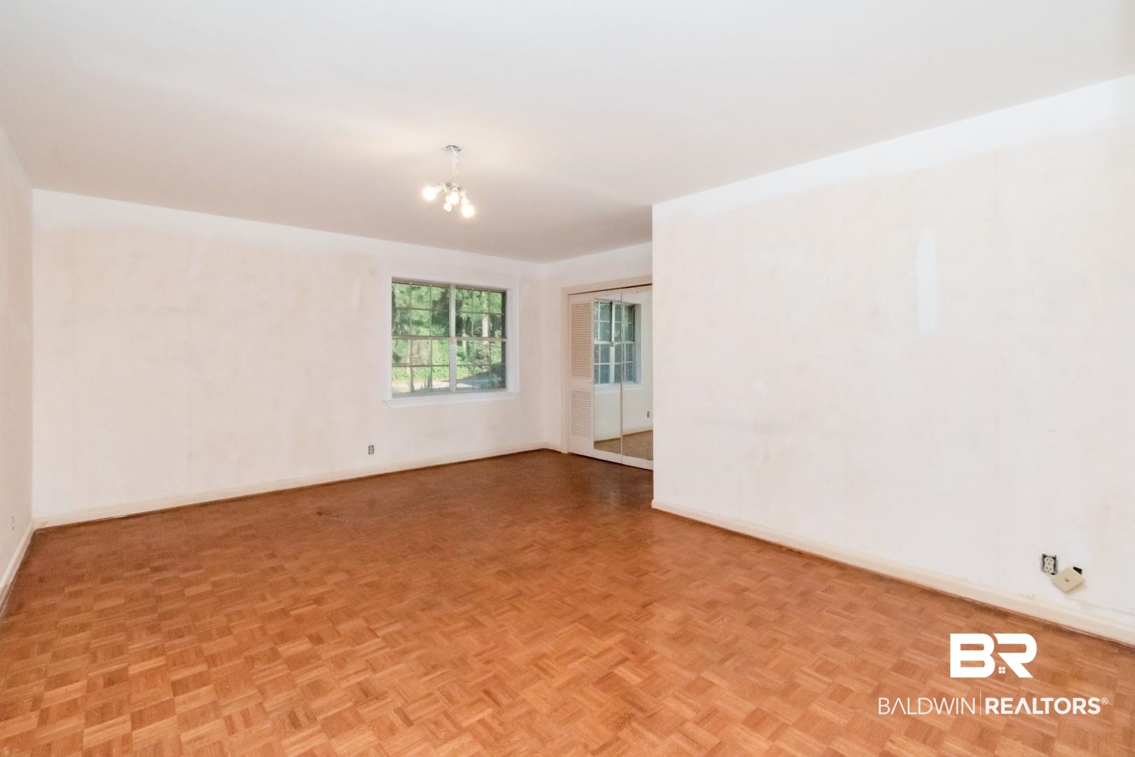 241 Suzanne Circle Mobile, AL 36608 - Photo 13 of 41 Unfurnished room with baseboards and a chandelier
