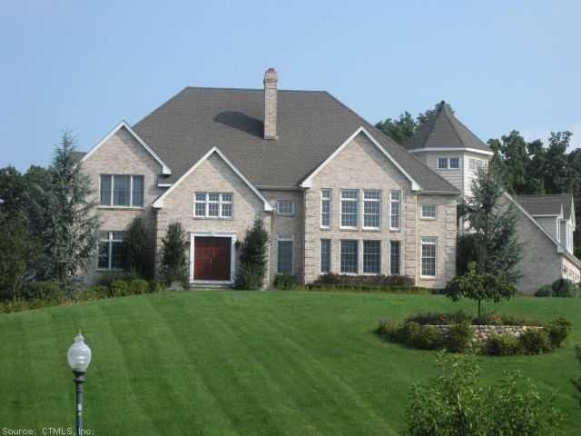 6 Stoney Brook Road Wallingford, CT 06492 - Photo 1 of 1 a front view of a house with a garden and plants
