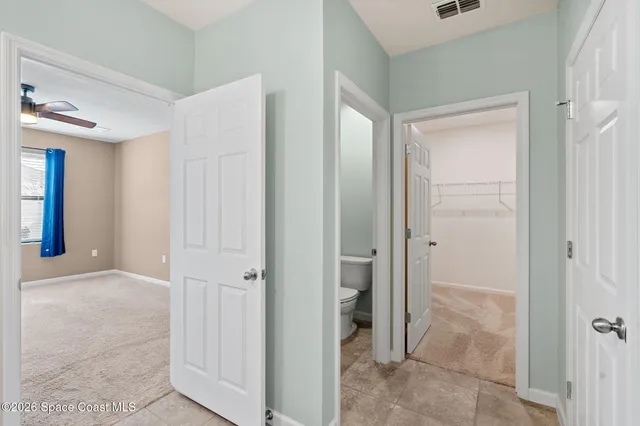 a view of a hallway with closet area