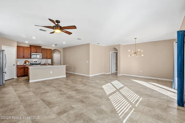 a view of a kitchen with a sink and a window