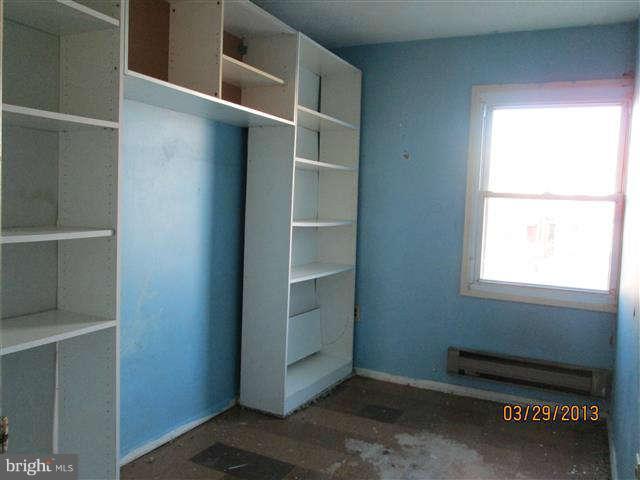 2106 Jasmine Road Baltimore, MD 21222 - Photo 12 of 17 a room with walk in closet and window