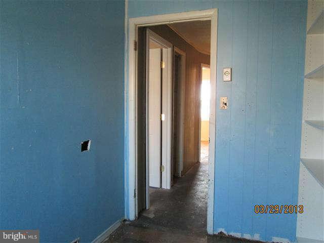 2106 Jasmine Road Baltimore, MD 21222 - Photo 13 of 17 a view of a hallway with wooden floor