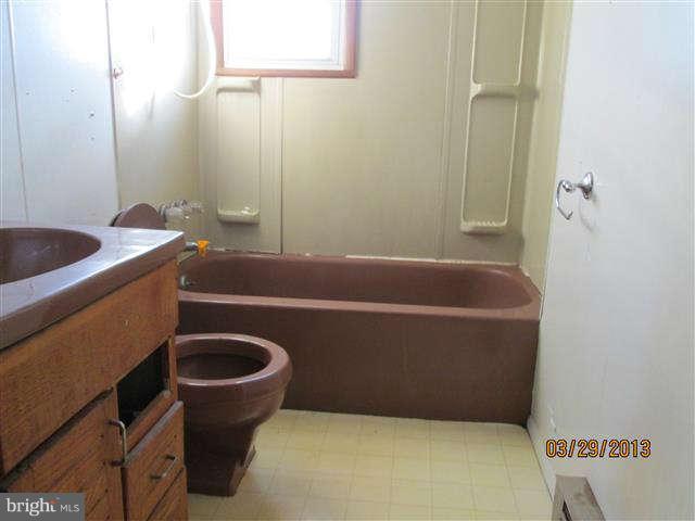 2106 Jasmine Road Baltimore, MD 21222 - Photo 15 of 17 a bathroom with a sink