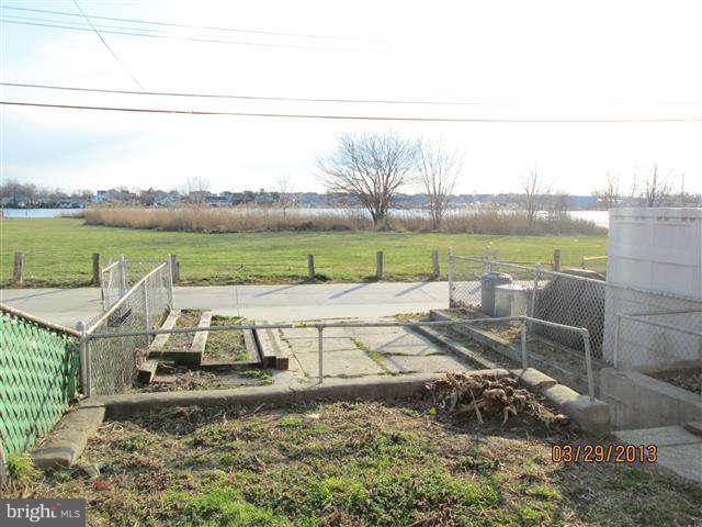 2106 Jasmine Road Baltimore, MD 21222 - Photo 3 of 17 a view of lake with green field