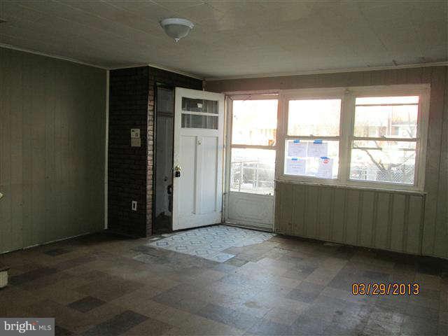 2106 Jasmine Road Baltimore, MD 21222 - Photo 5 of 17 an empty room with windows