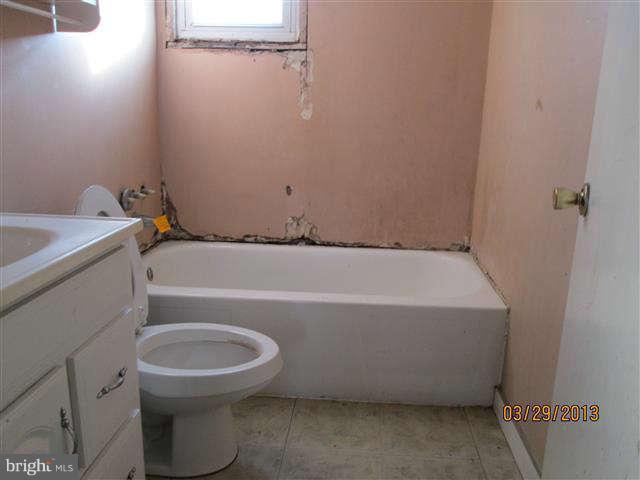 2106 Jasmine Road Baltimore, MD 21222 - Photo 8 of 17 a bathroom with a sink and toilet