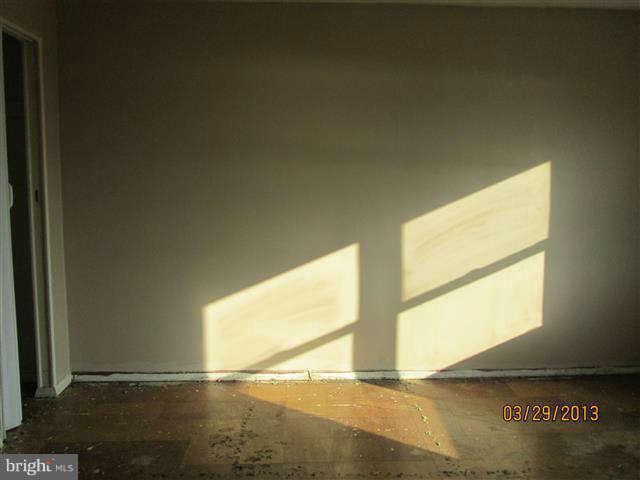 2106 Jasmine Road Baltimore, MD 21222 - Photo 9 of 17 a view of an empty room and a window