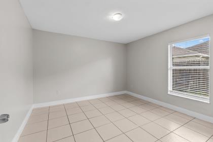 3718 Southwest Masilunas Street Port St. Lucie, FL 34953 - Photo 15 of 20 a view of an empty room and window