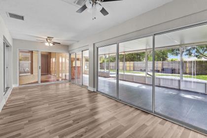 3718 Southwest Masilunas Street Port St. Lucie, FL 34953 - Photo 17 of 20 a view of an entryway with wooden floor