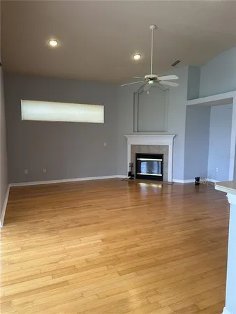 an empty room with a fireplace