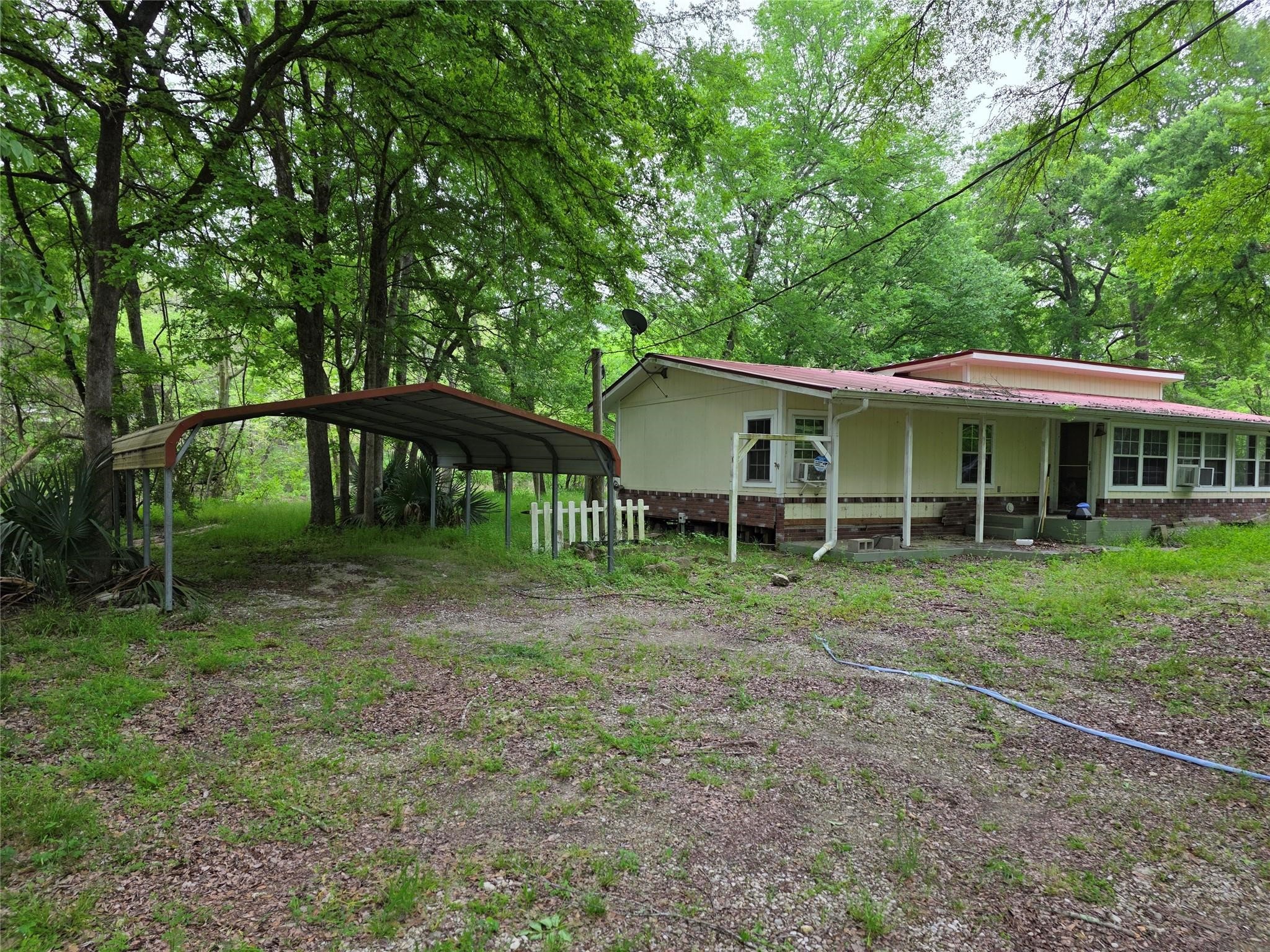 15 Caney Court Huntsville, TX 77320 - Photo 1 of 7 a view of a house with a yard