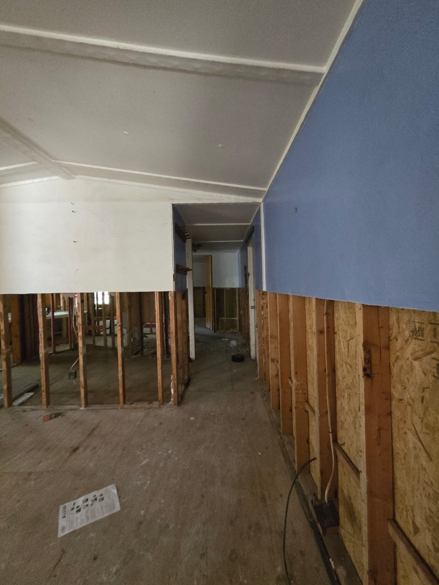 15 Caney Court Huntsville, TX 77320 - Photo 6 of 7 a view of a room with wooden walls